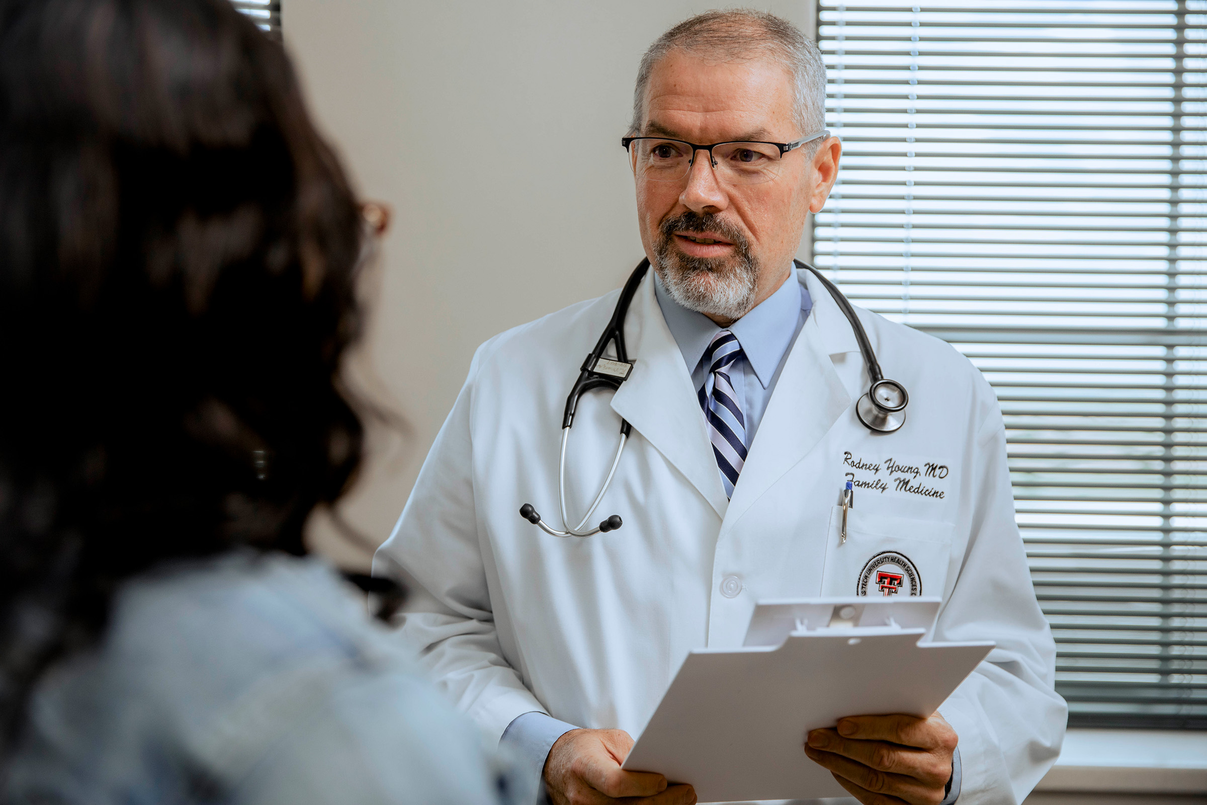 Doctor speaking to a patient in the clinic.