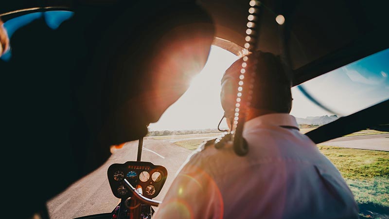 pilot in an airplane on the raod in the sun