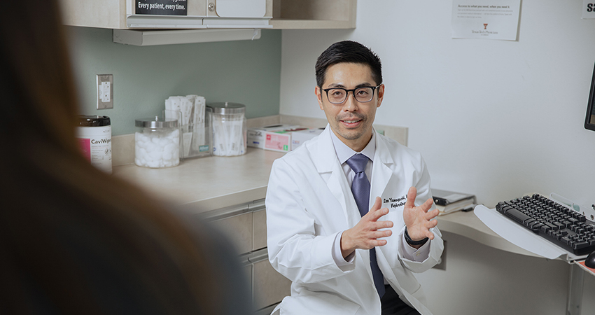 Dr. Yamaguchi consulting a patient